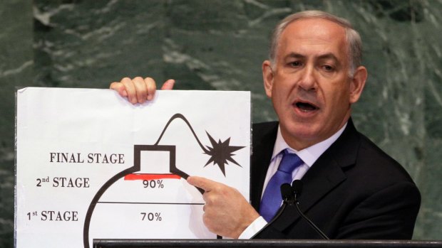 Israeli Prime Minister Benjamin Netanyahu says world powers "have given up" on stopping Iran from developing nuclear weapons.