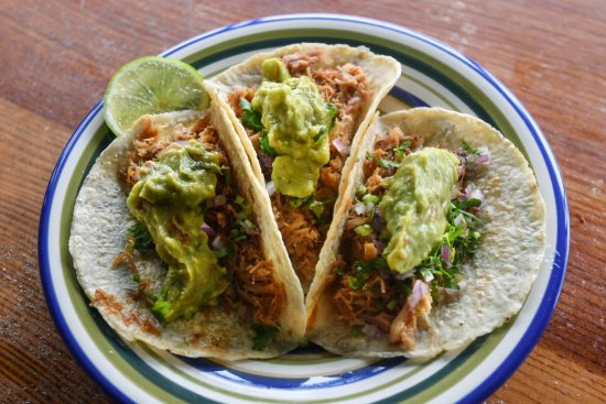 Don't miss the carnitas - slow-cooked shredded pork tacos.