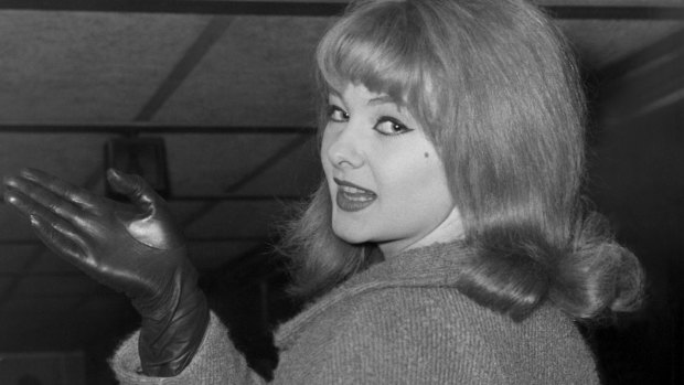 Mandy Rice-Davies in London in 1964, about to board a plane for a "singing engagement" in Munich.