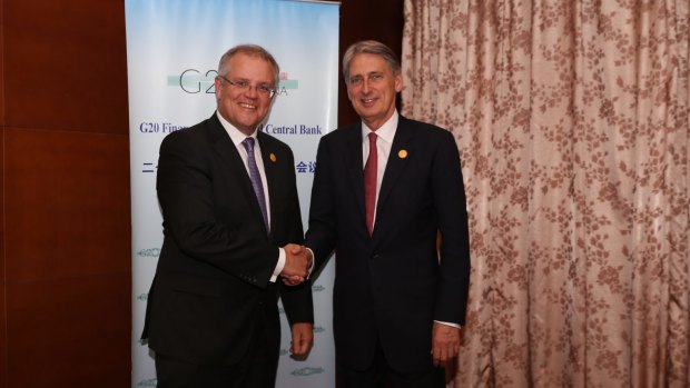 Treasurer Scott Morrison (left) with
British finance minister Phillip Hammond at the G20 meeting in Chengdu, China.