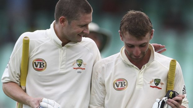 Michael Clarke and Phillip Hughes leave the pitch during Australia's tour of South Africa in 2009.