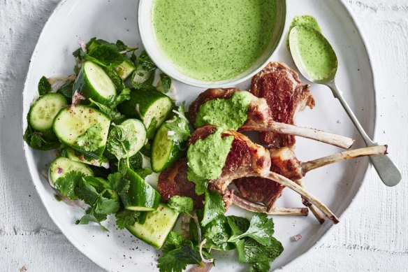 Grilled lamb cutlets with green tahini sauce and cucumber salad.