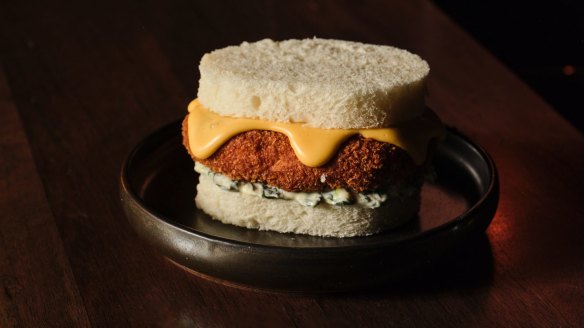 Crumbed whiting sandwich with mornay sauce on shokupan bread.