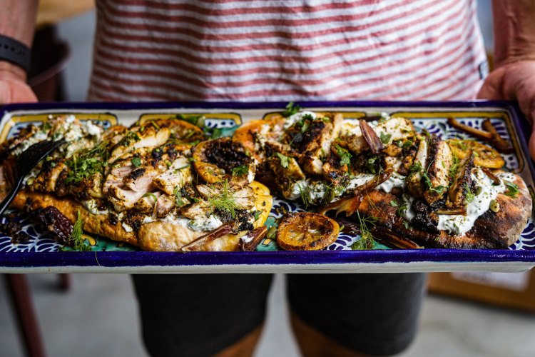 Grilled chermoula chicken with charred lemon, dates and tzatziki. 