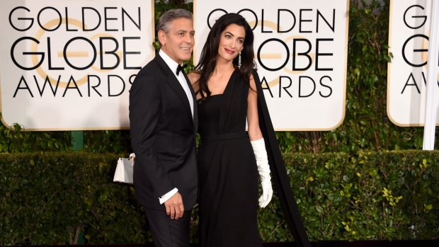 Handout: At the Golden Globes Amal Alamuddin Clooney's white gloves became a subject of discussion in the media.
