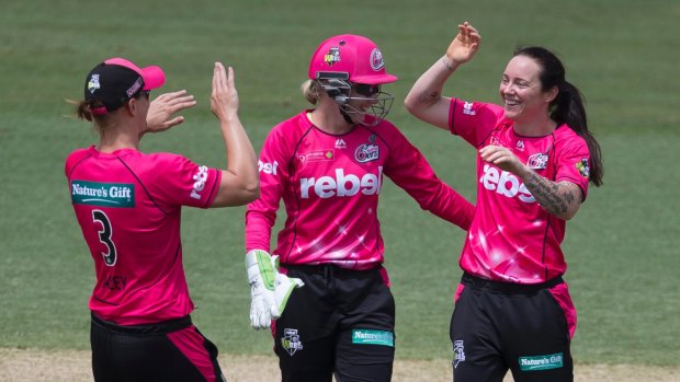 Coyte and bowled: Sarah Coyte celebrates taking a wicket in her return to top-level cricket.