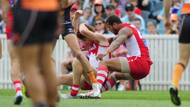 Impact: Lance Franklin reels after the head clash with Gary Rohan. 