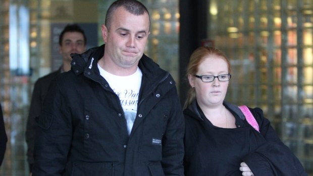 Justin Wright with his partner Aimee Sassine, the parents of Skye Sassine, outside the Downing Centre Courts during the trial of William Ngati in 2012.