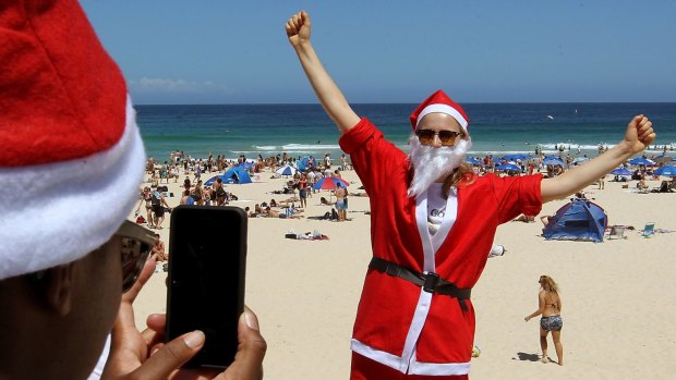 Natalie Williams from Britain celebrates Christmas at Bondi Beach.