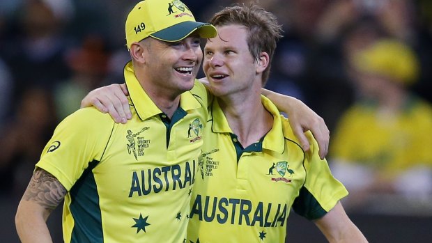 Local heroes: Michael Clarke and Steve Smith arm in arm after guiding Australia to victory.