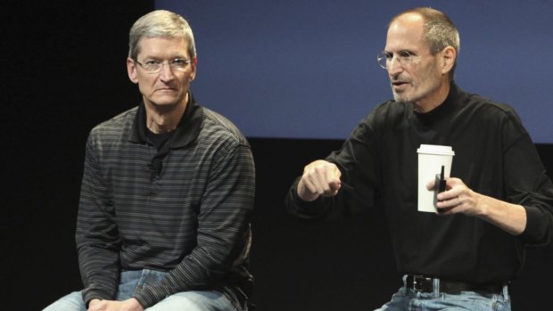 Apple CEO Tim Cook, left, with the late Apple co-founder Steve Jobs.