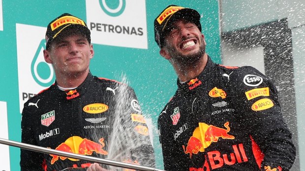 Happy team: Race winner Red Bull driver Max Verstappen sprays Daniel Ricciardo.
