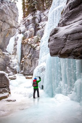 Ice climbers tackle frozen waterfalls from the canyon floor.