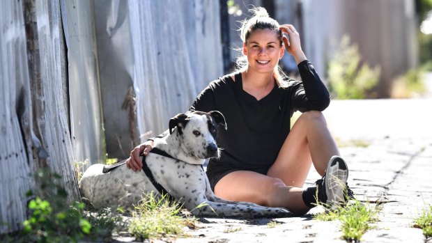 Katie Brennan with her dog Yonce. The Western Bulldogs captain has used her injury-plagued first season to strengthen mind and body.