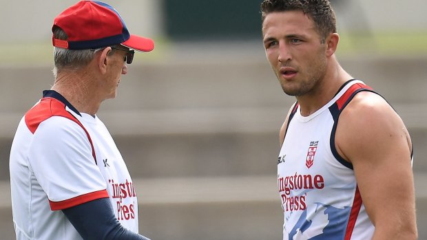 England coach Wayne Bennett talks to his skipper Sam Burgess at training in Melbourne.
