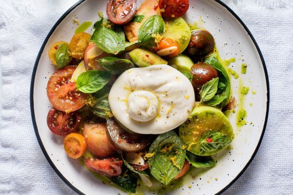 Burrata cheese balls with heirloom tomatoes and basil oil.