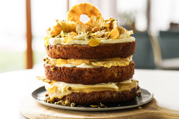 Sunshine on a plate: Hummingbird cake stacked with lemon curd and cream cheese icing, and topped with golden-hued decorations if you're feeling 'extra'.