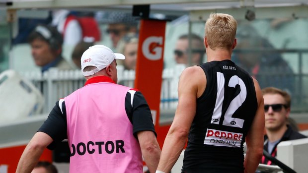 Nick Riewoldt leaves the ground.