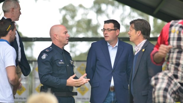 Premier Daniel Andrews with Roads Minister Luke Donnellan, right, and Victoria's head of road policing, Assistant Commissioner Doug Fryer, left. 