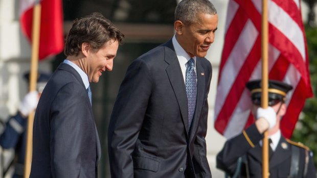 President Barack Obama and Canadian Prime Minister Justin Trudeau take the stage together during an arrival ceremony on the South Lawn of the White House, Washington.