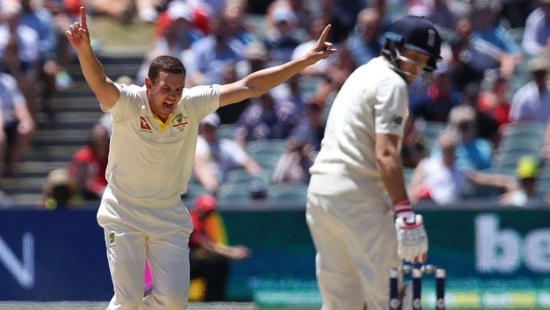 Crucial breakthrough: Josh Hazlewood is elated after dismissing England captain Joe Root on the fifth day in Adelaide.