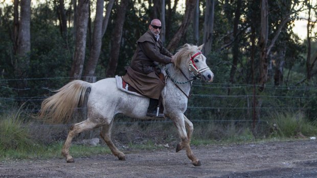 Mamdouh Elomar riding a horse near his family home, 2015.