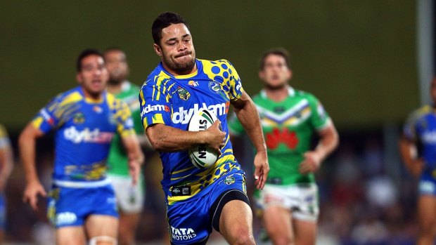 On the run in Darwin: Jarryd Hayne leaves the Canberra defence in his wake in 2014.