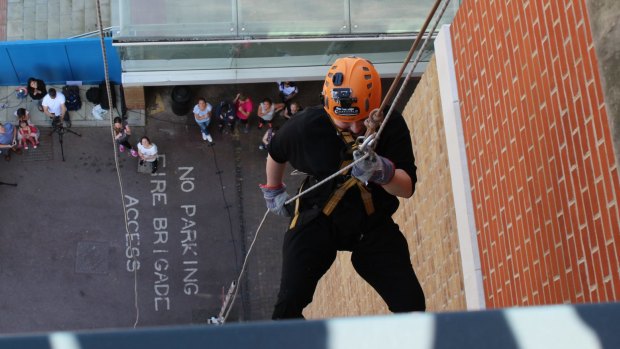 Hicks abseiling in London in June to raise funds for the hospital that saved her life.