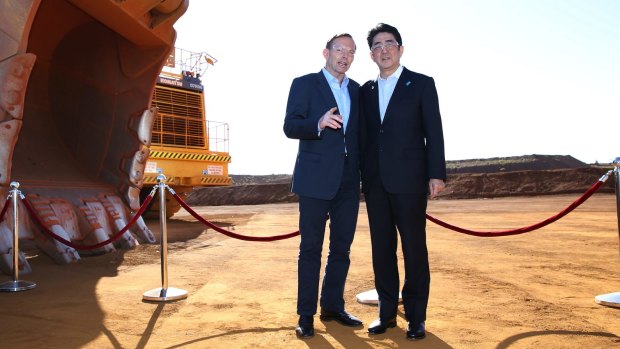 Tony Abbott shows Shinzo Abe a Rio Tinto iron ore mine in Western Australia.