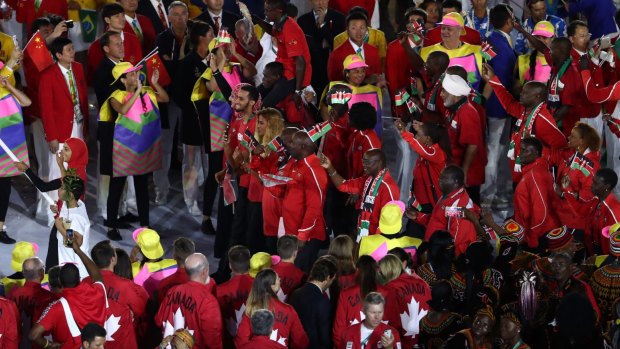 The Kenyan team, led by flag bearer Shehzana Anwar, enter the stadium during the Opening Ceremony of the Rio 2016 Olympic Games.