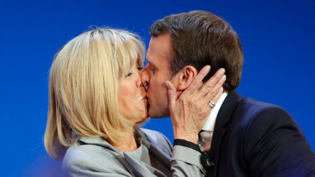 New French president Emmanuel Macron kisses his wife Brigitte.