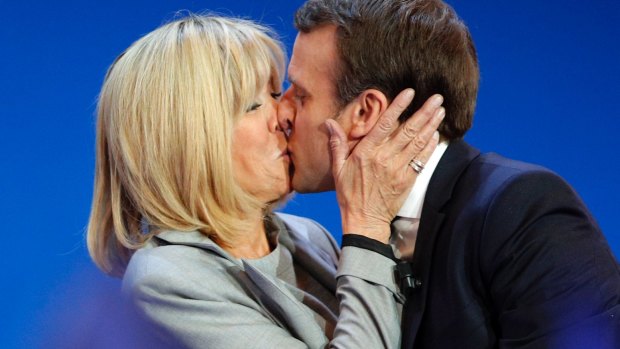 French centrist presidential candidate Emmanuel Macron kisses his wife Brigitte before addressing his supporters at his election day headquarters in Paris on Sunday.