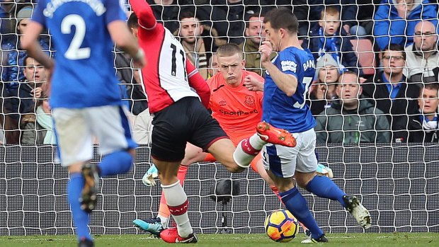 Southampton's Dusan Tadic scores his side's first goal against Everton at St Mary's on Sunday.