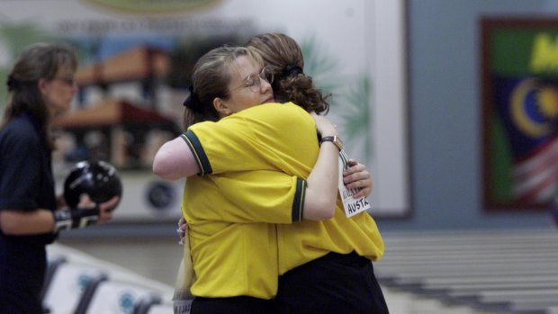 Cara Honeychurch hugs her partner Maxine Nable after they won the women's doubles at the 1998 Commonwealth Games in Kuala Lumpur.
