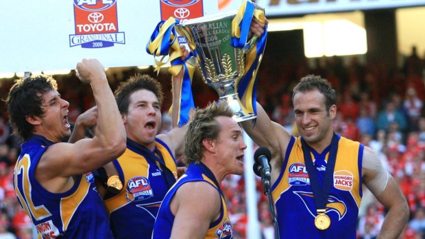 Andrew Embley, Ben Cousins, Daniel Chick and Chris Judd lift the 2006 Premiership Cup.