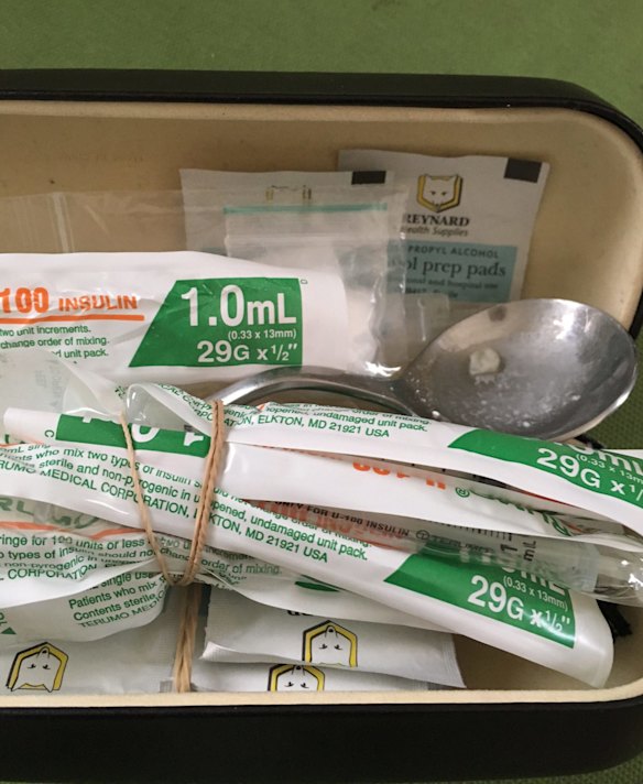 The photograph that purports to show heroin and drug paraphernalia found on employee.