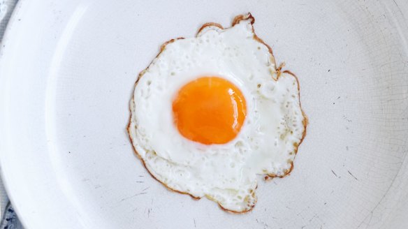 It's a perfect lacy-edged fried egg - but those tiny cracks in the pan's surface could cause it to stick.