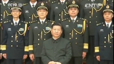 Chinese President Xi Jinping (seated) with Lieutenant-General Yang Xuejun (second from right, front row). 