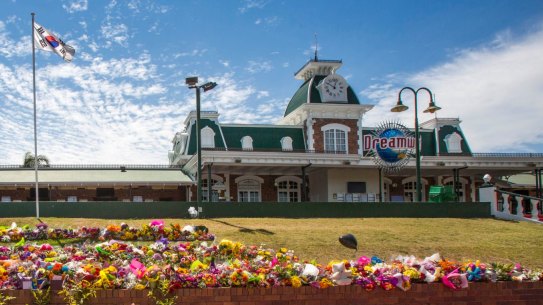 Floral tributes outside Dreamworld where the deaths of four people have raised questions about workplace laws in Queensland and prompted a safety review of the state's theme parks.  