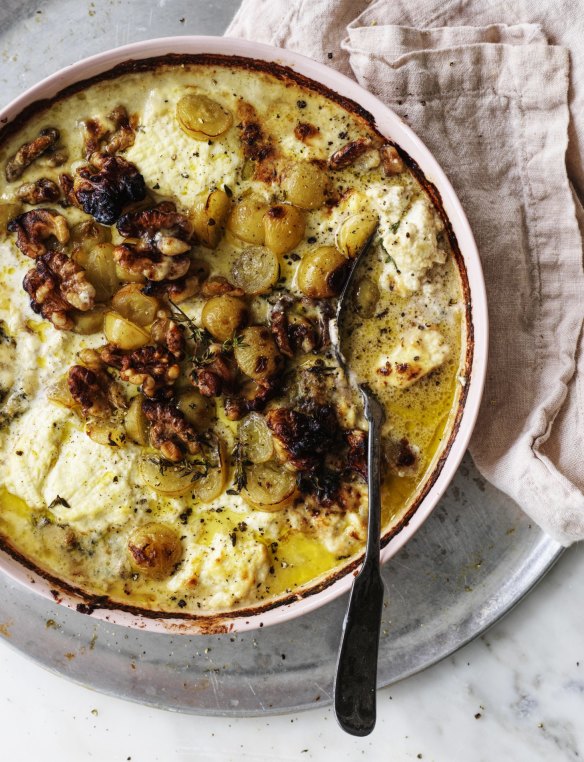 Baked ricotta topped with grapes and walnuts.