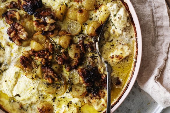 Baked ricotta topped with grapes and walnuts.