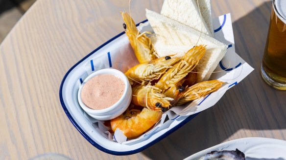 The peel and eat prawn bucket at Stokehouse's Pontoon deck.