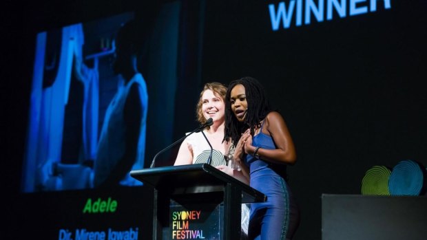 Writer and director Mirene Igwabi with producer Grace Julia accept the award at the Sydney Film Festival.