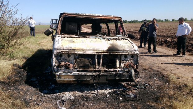 The burnt-out van registered to missing Australian surfer Adam Coleman.