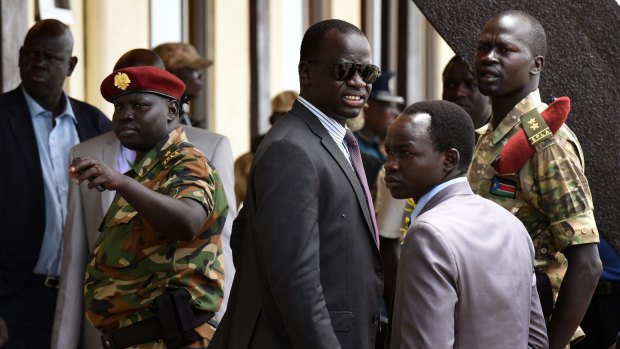 Angelo Kuot Garang (in sunglasses) at Juba airport awaiting the return of rebel leader and South Sudanese Vice-President Riek Machar.
