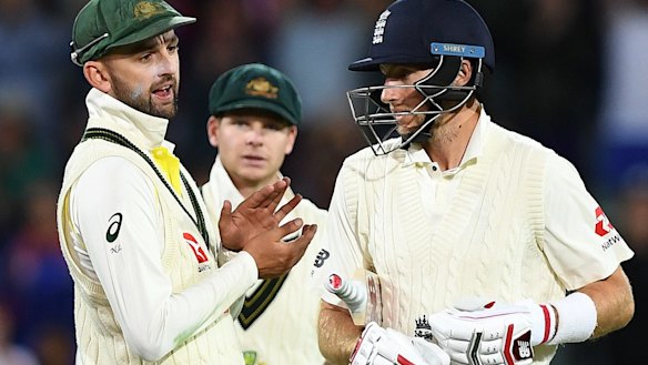 Nathan Lyon has words with England captain Joe Root during the tense second Test at the Adelaide Oval.
