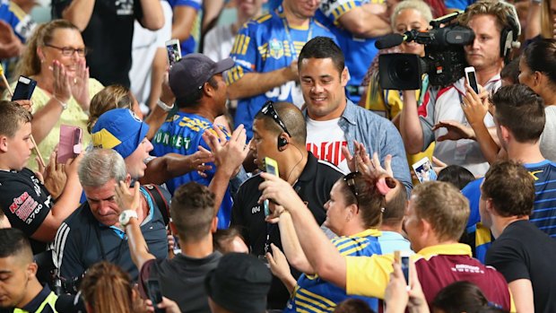 On camera: Jarryd Hayne among fans at Pirtek Stadium on Thursday night. Hayne's NFL story will feature on 60 minutes.