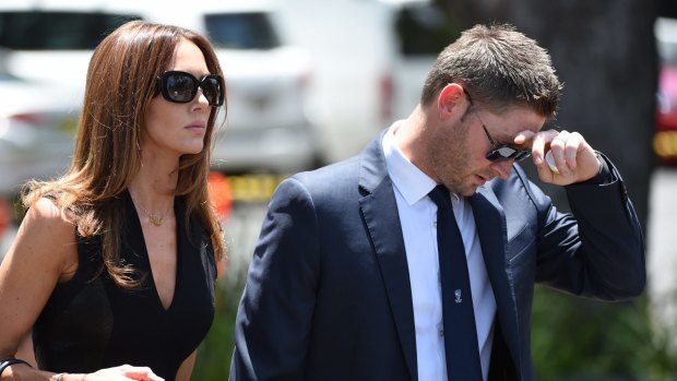 Distraught: Michael and Kyly Clarke arrive for Phillip Hughes' funeral.
