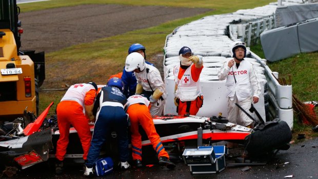 Jules Bianchi receives urgent medical treatment after colliding with a recovery vehicle during the Japanese Formula One Grand Prix.