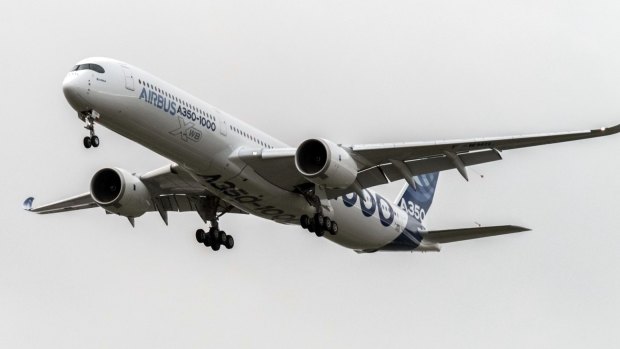 The Airbus A350-1000 comes into land following its first flight at the Airbus factory in Toulouse, France, on Thursday.